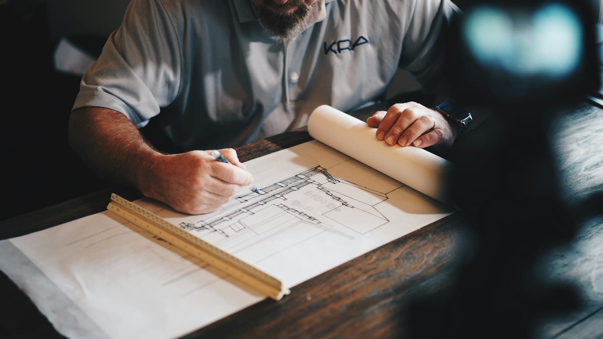 Architect reviewing technical drawings
